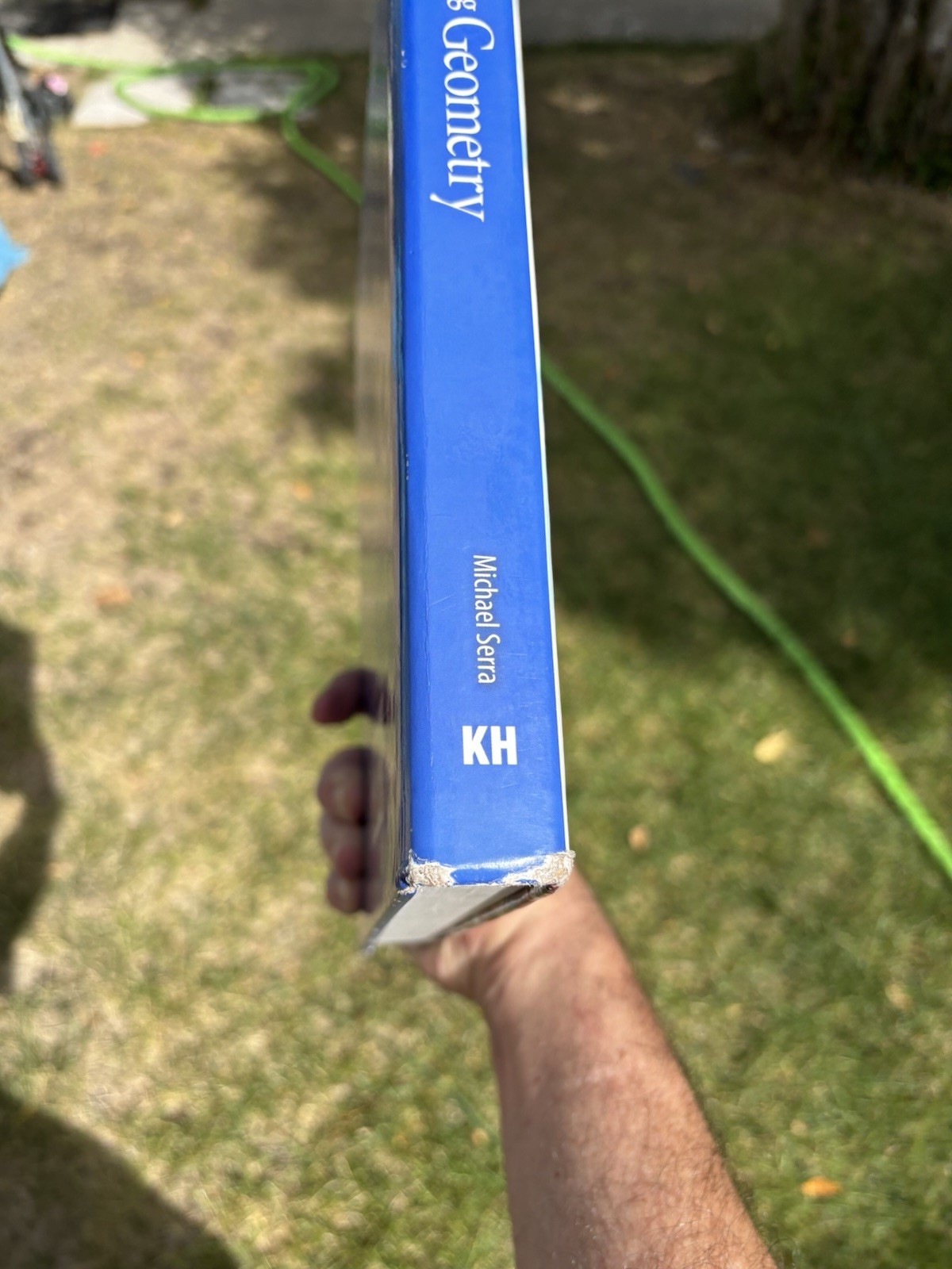 Discovering Geometry Michael Serra Fifth Edition Math Textbook by Kendall Hunt